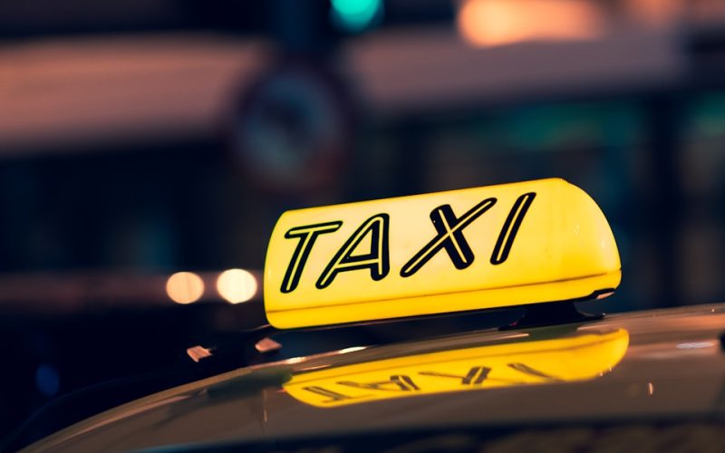 yellow taxi cab on road during night time