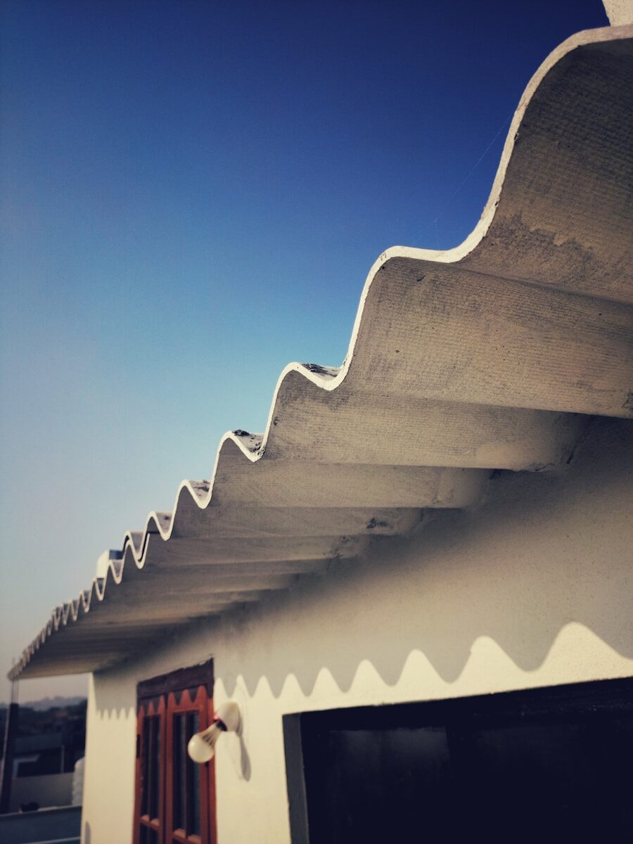 white and red concrete building under blue sky during daytime